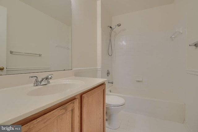 full bathroom with tiled shower / bath, vanity, toilet, and tile patterned floors