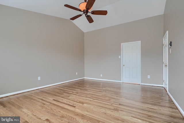 unfurnished room with ceiling fan, lofted ceiling, and light wood-type flooring