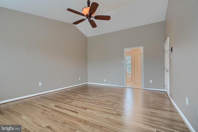 unfurnished room with vaulted ceiling, ceiling fan, and light hardwood / wood-style flooring