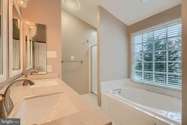 bathroom with independent shower and bath, vanity, and lofted ceiling