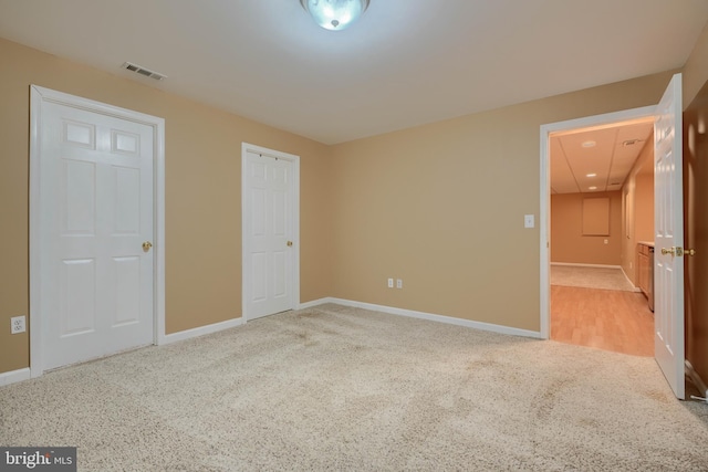 unfurnished bedroom with carpet