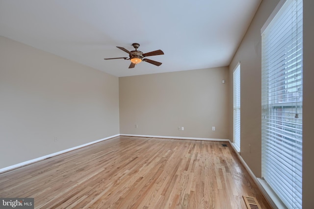 unfurnished room featuring ceiling fan and light hardwood / wood-style floors