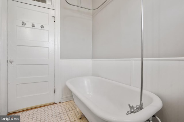 full bath featuring a freestanding bath