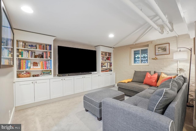 living area with lofted ceiling with beams, light carpet, and recessed lighting