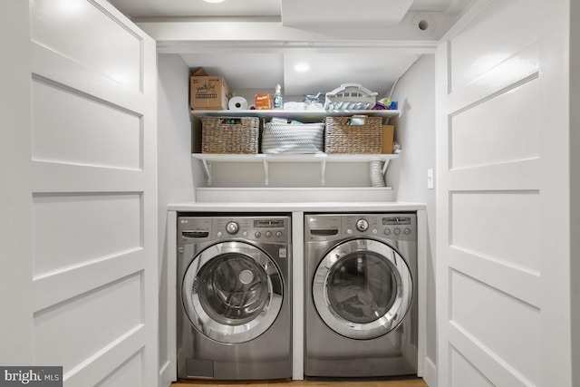 washroom featuring laundry area and independent washer and dryer