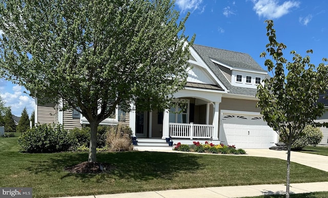 view of front of house with metal roof, covered porch, concrete driveway, roof with shingles, and a standing seam roof