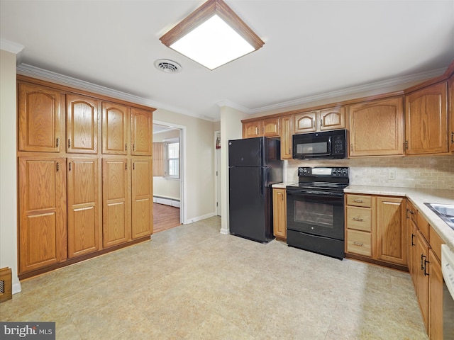 kitchen with sink, baseboard heating, ornamental molding, decorative backsplash, and black appliances