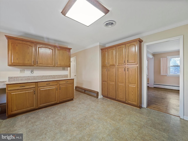 kitchen featuring a baseboard heating unit and ornamental molding