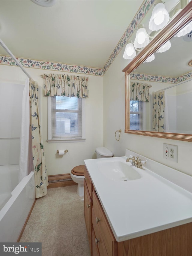 full bathroom featuring tile patterned flooring, vanity, toilet, and shower / bath combo with shower curtain