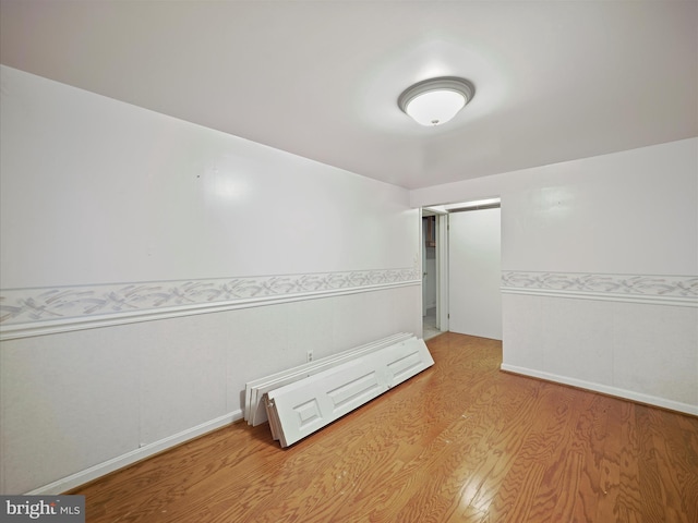 spare room with light hardwood / wood-style floors