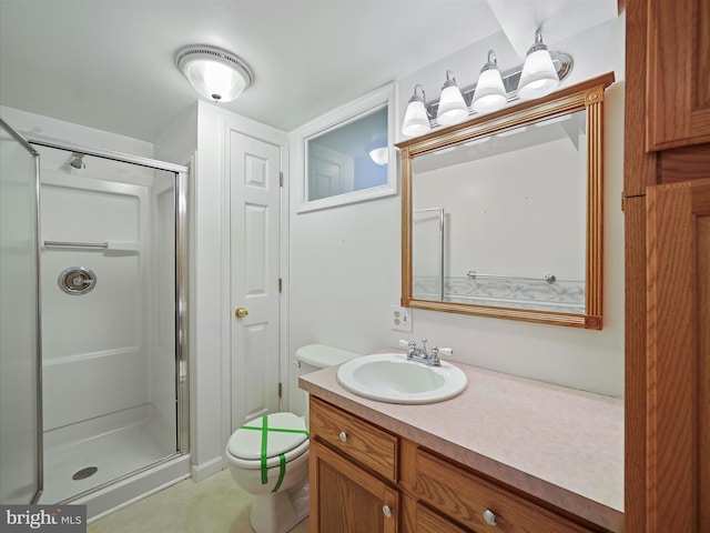 bathroom featuring walk in shower, vanity, and toilet