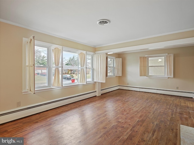 unfurnished room featuring crown molding, hardwood / wood-style floors, and baseboard heating