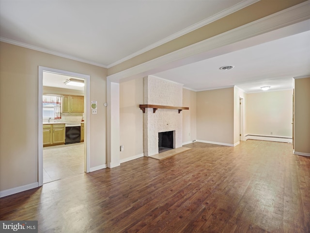 unfurnished living room featuring sink, a baseboard heating unit, a fireplace, ornamental molding, and wood-type flooring