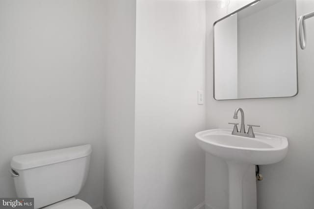 half bathroom with toilet