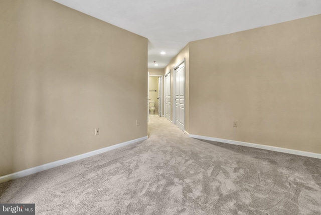 empty room with light colored carpet