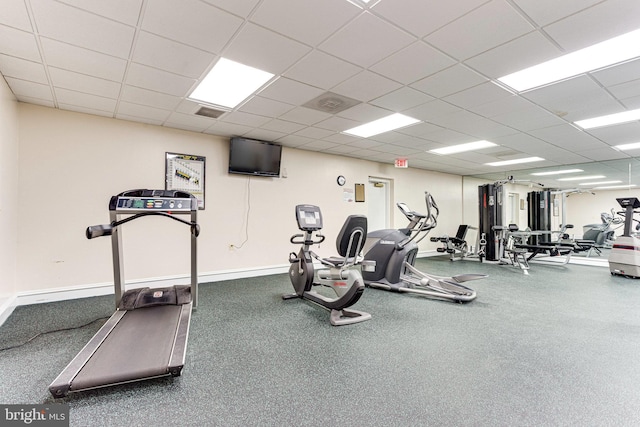 workout area featuring a paneled ceiling