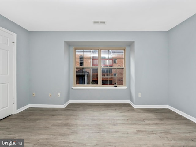 empty room featuring hardwood / wood-style floors