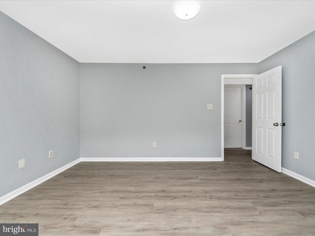 spare room featuring hardwood / wood-style flooring