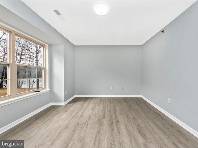 spare room featuring light hardwood / wood-style flooring