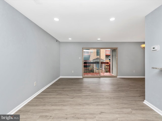 spare room with light wood-type flooring