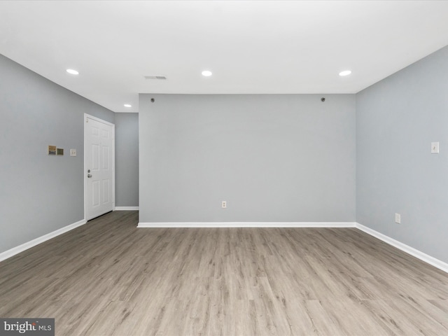 spare room featuring light hardwood / wood-style floors