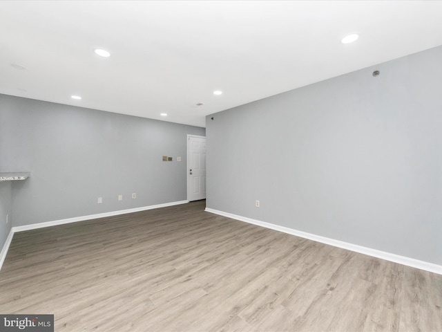 spare room featuring light hardwood / wood-style floors