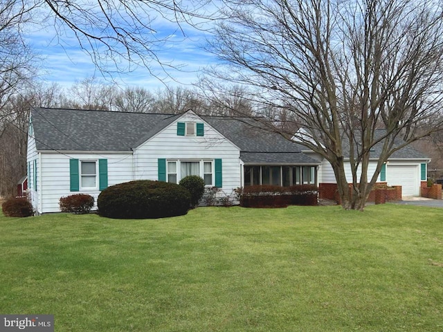 ranch-style home featuring a garage and a front yard