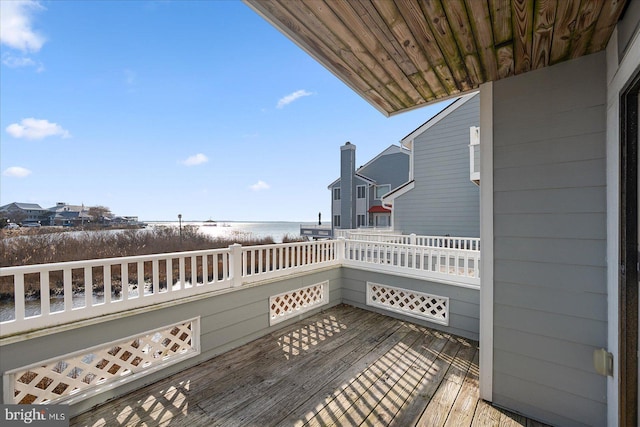 wooden terrace with a water view