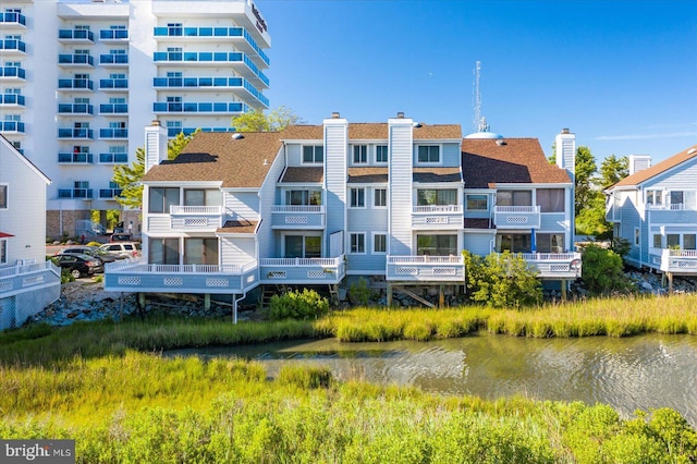 view of building exterior with a water view