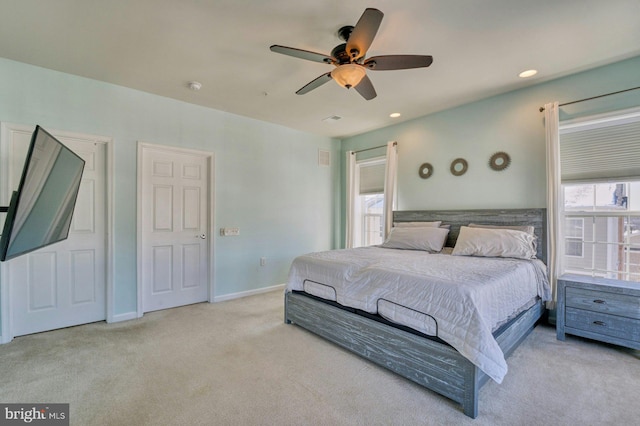 bedroom with light carpet and ceiling fan