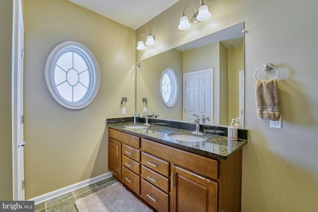 bathroom featuring tile patterned flooring and vanity