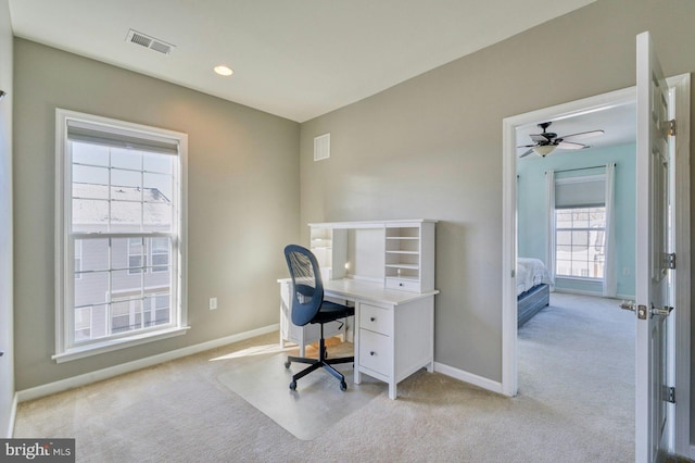 home office featuring light carpet