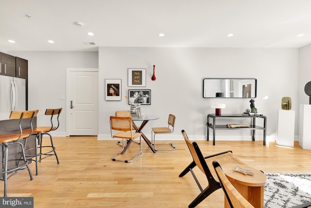 dining area featuring baseboards, recessed lighting, visible vents, and light wood-style floors