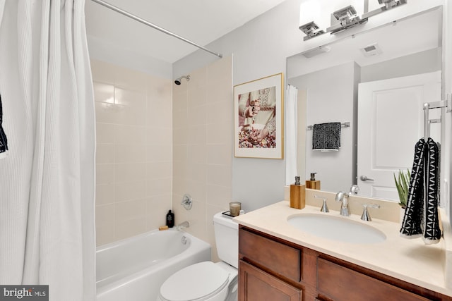 full bathroom featuring visible vents, shower / tub combo with curtain, vanity, and toilet