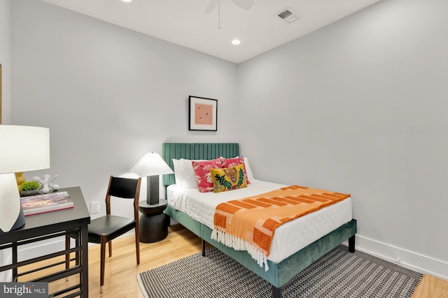 bedroom featuring recessed lighting, wood finished floors, visible vents, and baseboards