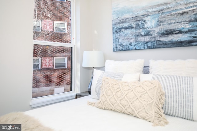 bedroom with brick wall