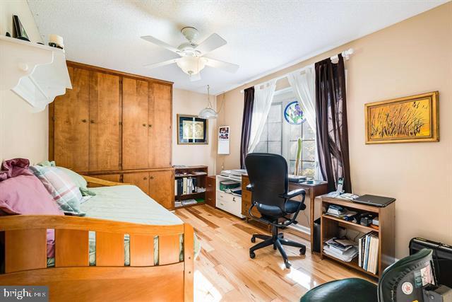 bedroom with light hardwood / wood-style floors