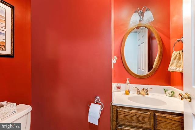 bathroom with vanity and toilet