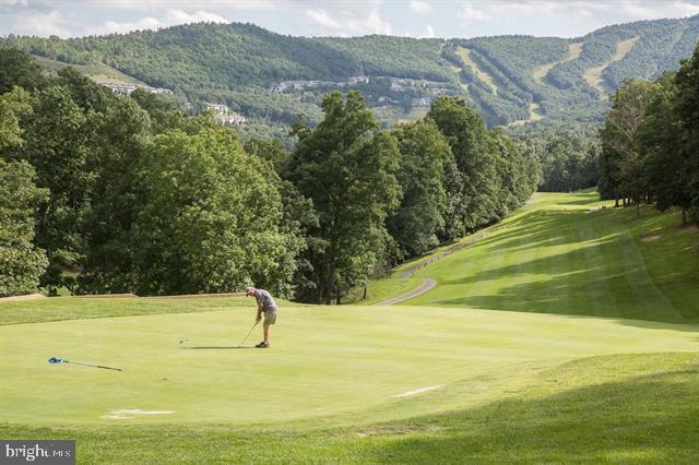 surrounding community with a mountain view