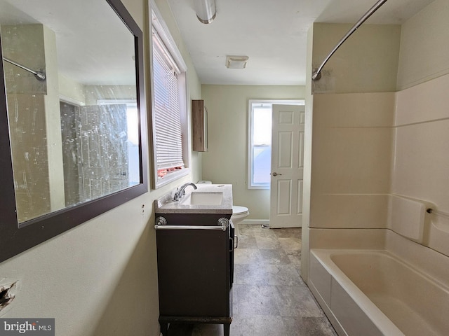 full bathroom with vanity, toilet, and washtub / shower combination