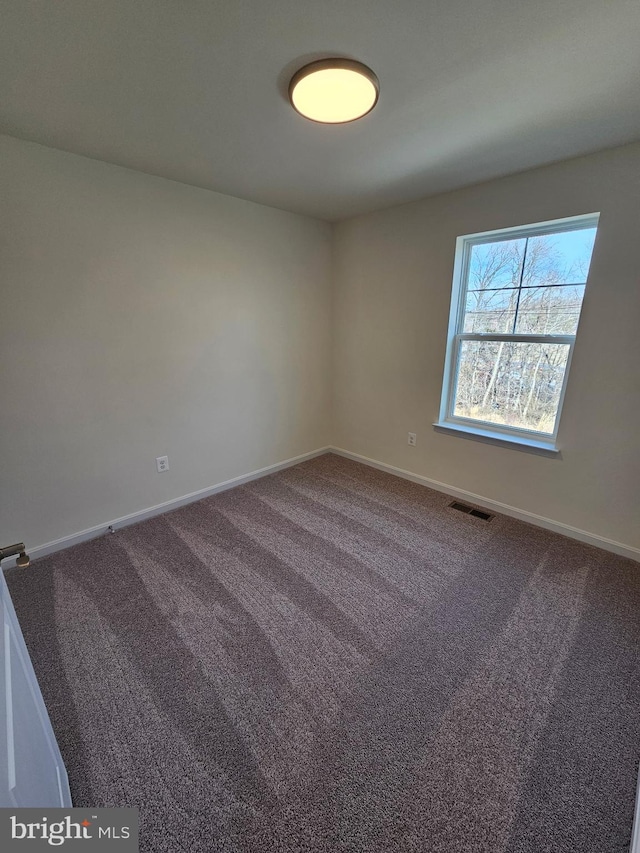 empty room with carpet flooring