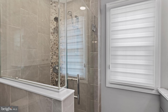 bathroom featuring an enclosed shower