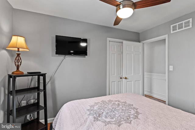 bedroom featuring ceiling fan and a closet