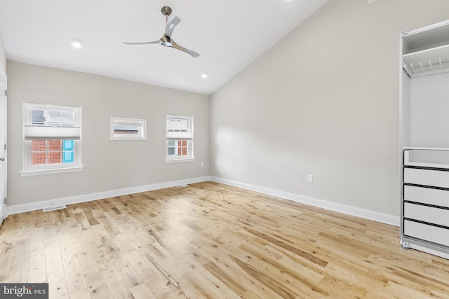 unfurnished bedroom with light wood-type flooring, vaulted ceiling, and ceiling fan