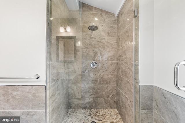 bathroom with tile walls and walk in shower