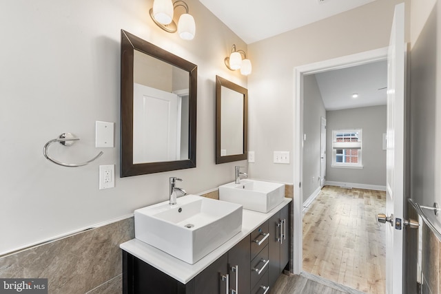 bathroom featuring wood-type flooring and vanity