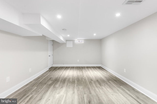 basement with light wood-type flooring