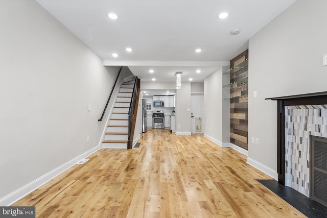 unfurnished living room featuring light hardwood / wood-style floors