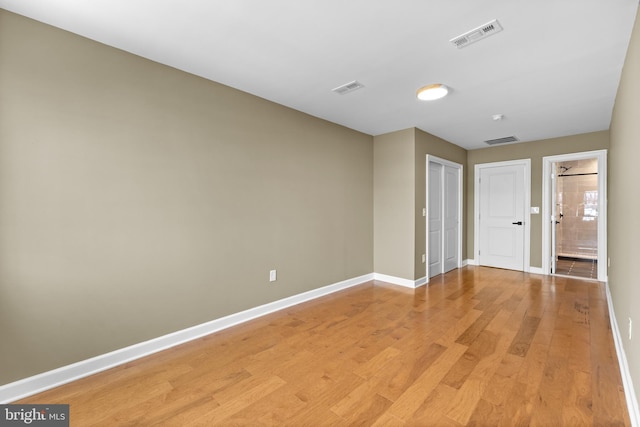 unfurnished room featuring light hardwood / wood-style floors