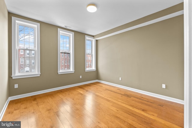 empty room with light wood-type flooring